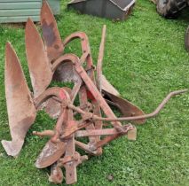 Vintage three furrow tractor plough