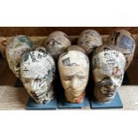 Set of seven decoupage hat or wig stands each 31cm high (7)