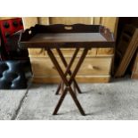 Antique mahogany butlers tray on more recent folding stand