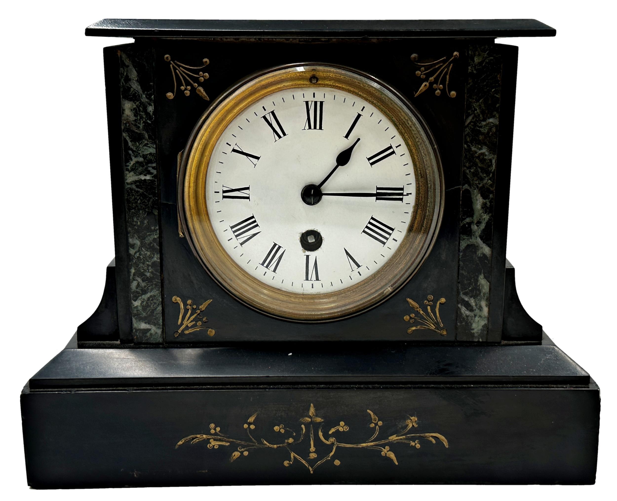 A 19th century black slate mantel clock, 21cm high