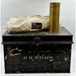 Jappaned tin military trunk inscribed H.H. Wilson, 31 x 51cm, with a trench art shell and