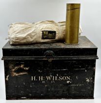 Jappaned tin military trunk inscribed H.H. Wilson, 31 x 51cm, with a trench art shell and