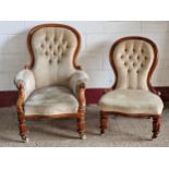 Two Victorian button back nursing chairs with fluted feet and ceramic castors, armchair 105cm