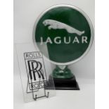Cast iron Jaguar advertising signage, 52cm high together with a further Rolls Royce Perspex sign (2)