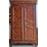 19th century French fruitwood armoire, with scrolled panelled doors, enclosing an interior fitted