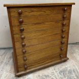 Modern oak collectors chest with eight drawers, 69 x 64cm