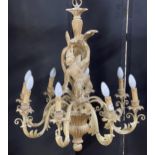 Good quality Italian carved softwood eight branch chandelier, centrally decorated with a monkey