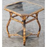 Antique bamboo occasional table, the octagonal top with Chinoiserie decoration raised upon swept