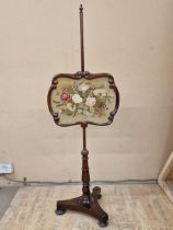 Regency mahogany pole screen, fitted with a floral wool work tapestry panel, 142cm high