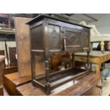 Jacobean style oak credence type cabinet, fitted with a panelled cupboard door, 74cm high x 91cm