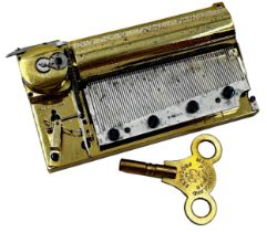 Good early polished brass compact Freres Nicole music box movement, stamped to the comb 10cm long