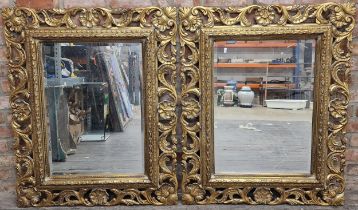Pair of rococo gilt wall mirrors with bevelled plates, 110cm high