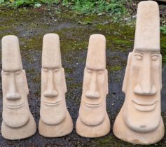 Three reconstituted stone Easter Island heads, 54cm high, together with a further larger example,