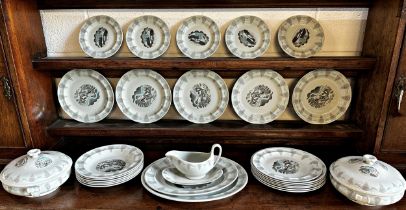 A Wedgwood 'Travel' series dinner service by Eric Ravilious. Each piece printed with a different