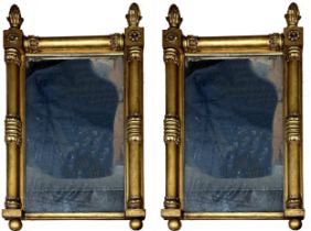 Pair of Regency giltwood and gesso pier mirrors with original pitted glass and pineapple finials,