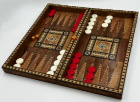 Good quality late 19th century parquetry backgammon games box with counters and dice, 49cm x 49cm