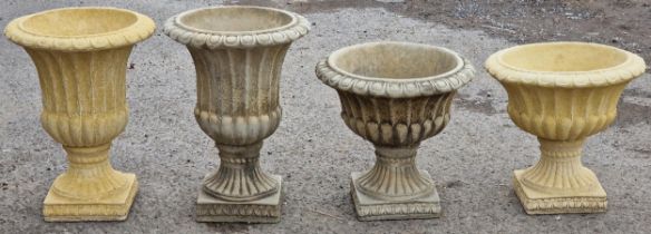 Willowstone - Two pairs of garden urns with gadrooned detail and flared rims, raised on fluted