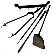 Good quality iron four piece fire tool set with unusual plaited hand grips, together with an iron