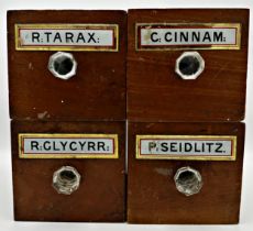 Four mahogany apothecary drawers labelled with various names