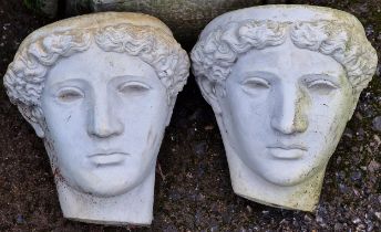 Pair of reconstituted stone wall hanging face masks, 20cm high