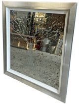 Large contemporary silver framed mirror embellished with a sparkling liquid art 3D design of a