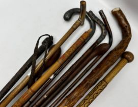 Collection of ten various walking sticks/canes to include a silver topped crooked bamboo shafted