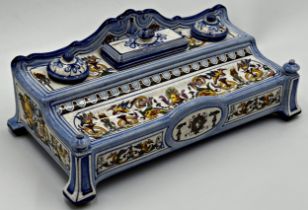 A French Faience ware desk standish, with typical scrolled decoration with blue borders, 13cm H x