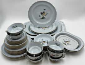 A collection of Spode Queen's Bird pattern dinner wares comprising various dishes, plates,