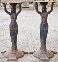 A pair of Art Deco Egyptian Revival cast iron table bases, 71cm high (2)