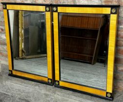 Pair of Bedemeier style wall mirrors with ebonised highlights and gilt metal flowerhead roundels,