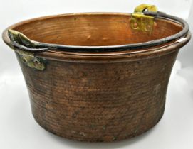 Large Eastern copper log bucket with rivetted brass supports and iron handle, 49cm diameter