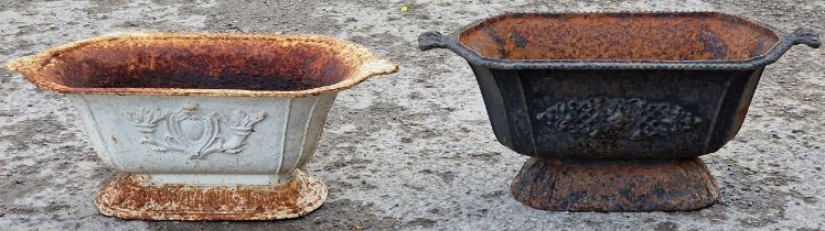 Two similar antique cast iron planters with twin handles and flared rims, 27cm high x 62cm wide (