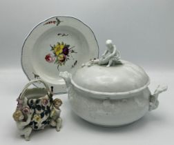 Meissen Blanc de chine porcelain twin handled turine mounted by a cherub holding a cornucopia with