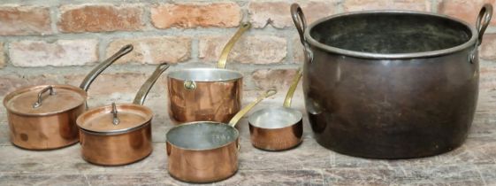 Good collection of lidded copper and iron saucepans, with a good copper twin handled cauldron and