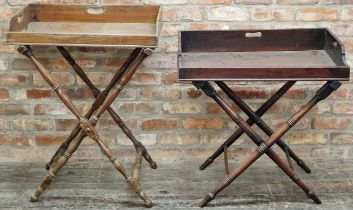 Three antique mahogany butlers trays, two complete with folding stands, tallest 93cm high (3)