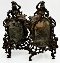 Pair of bronzed cast metal easel mirrors each mounted by a reclining semi-nude maiden and cherubs