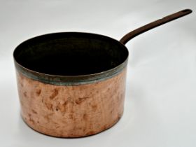 A large copper saucepan with iron handle, 61cm L in total