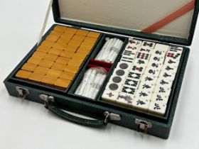 Vintage leather cased mah-jong set in unused condition