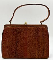 A beautiful 1940s brown snakeskin bag by Mappin & Webb. Hardware in gilt metal with strong clasp