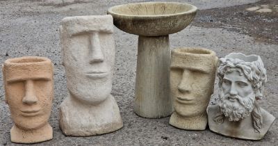 Four reconstituted stone planters in the form of heads including one of classical Greek design,