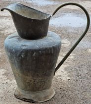 Vintage copper pitcher with scrolled tubular handle and flared spout, 54cm high (holes drilled to