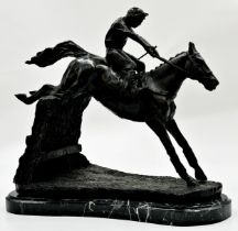 Bronze character group of jockey and rider jumping a fence, upon a black shaped marble base, 32cm