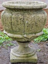 Large reconstituted stone garden urn with lobed bowl raised on a pedestal base, 57cm high x 41cm