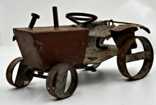 A good antique novelty scratch built iron scale model of a tractor, 31cm long