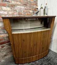 A vintage mid 20th Century cocktail bar with Formica top and glazed front with buttoned vinyl