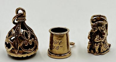 Two 9ct charms - a Toby jug with hinged base and tankard, with a further gold and smoked quartz
