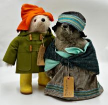 Original Paddington Bear and Aunt Lucy fully dressed in original clothing; duffle coat, wellington