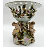 German (probably Dresden) porcelain centrepiece, with pierced bowl with trailing roses over three