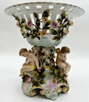 German (probably Dresden) porcelain centrepiece, with pierced bowl with trailing roses over three