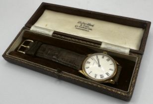 1950s 18ct Gubelin dress watch, 36mm case, silvered dial with Roman numerals, period leather